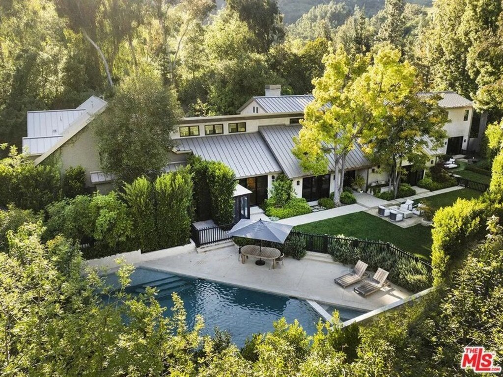 The luxe pool is well hidden by the surrounding hedges. Picture: Realtor.com