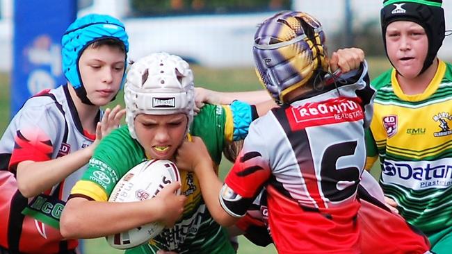 Mareeba Junior Rugby League player Darcy Adams fights his way through Redlynch players. PHOTO: Kristy Moore