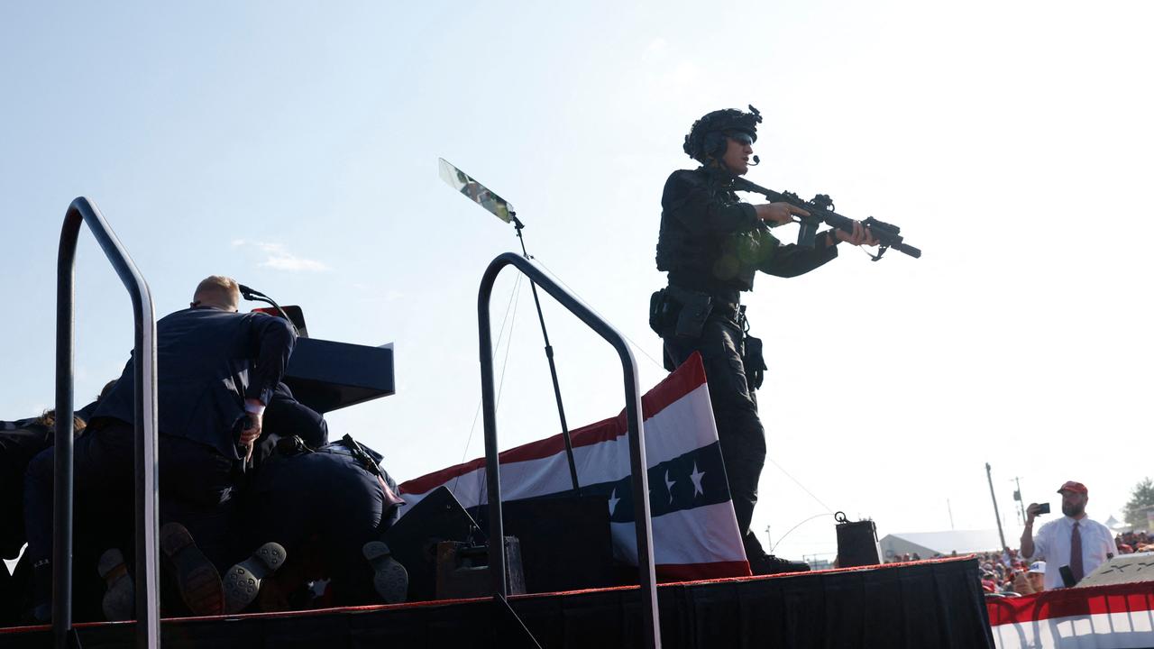 Security forces sweep in as shots ring out. Picture: Getty Images via AFP