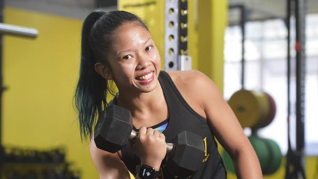 Darwinl personal trainer Emily Tjung tries out the amazing Fitbit Versa smartwatch.  Picture: Keri Megelus