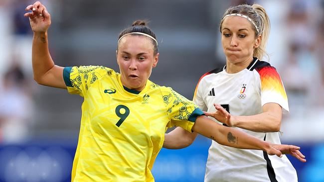 MARSEILLE, FRANCE - JULY 25: Caitlin Foord #9 of Team Australia is challenged by Kathrin Hendrich #3 of Team Germany during the Women's group B match between Germany v Australia during the Olympic Games Paris 2024 at Stade de Marseille on July 25, 2024 in Marseille, France. (Photo by Alex Livesey/Getty Images)