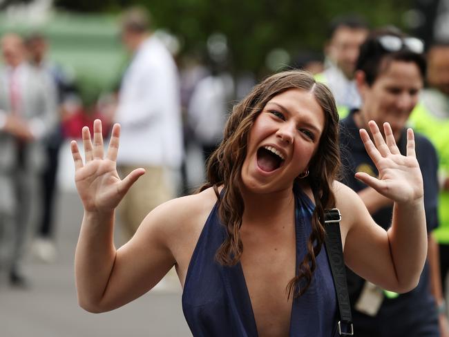 Racegoers arrive and show their enthusiasm prior to Sydney Racing