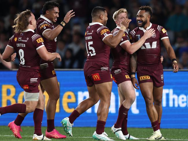 Hamiso Tabuai-Fidow celebrates a try with his Maroons teammates. Picture: Getty Images