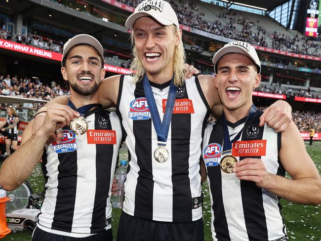 MELBOURNE , AUSTRALIA. September 30, 2023. AFL Grand Final between Collingwood and the Brisbane Lions at the MCG.   Nick Daicos, Darcy Moore and Josh Daicos of the Magpies   .Picture by Michael Klein