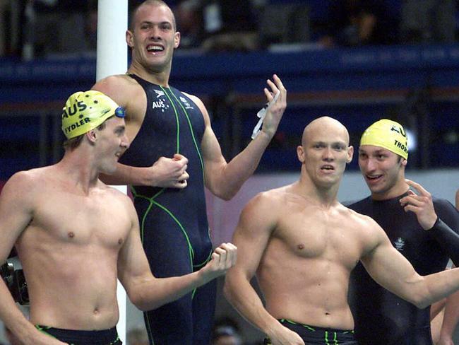 Australia's Chris Fydler, Ashley Callus, Michael Klim and Ian Thorpe play air guitar after beating the US for gold at the 2000 Sydney Olympics. Picture: Supplied