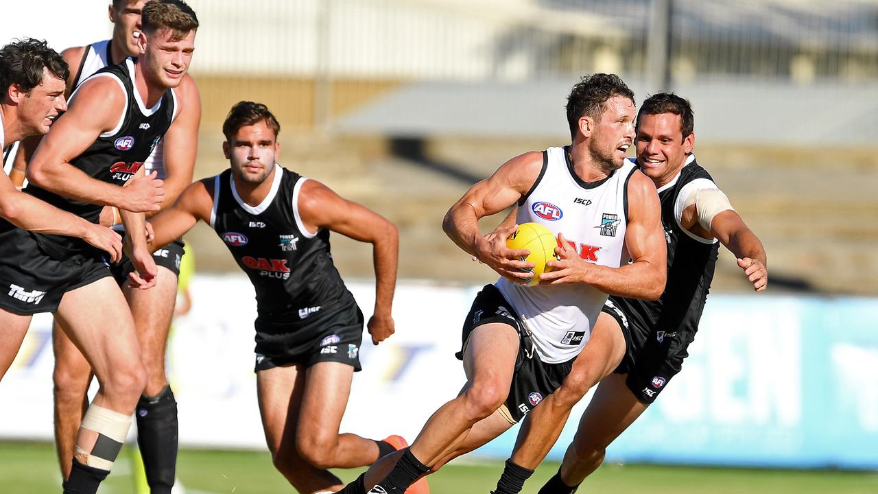 Port Adelaide’s Travis Boak evades Steven Motlop in Friday’s internal trial game. Picture: Tom Huntley