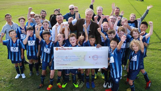 It’s all smiles during the cheque presentation for Roselea Football Club with Bennelong MP John Alexander. Picture: Mark Scott