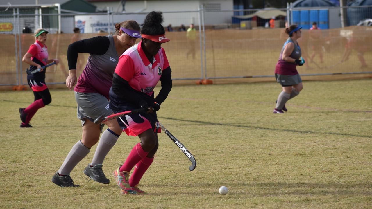 Toowoomba's Kimberley Daniels guiding the ball to her teammates in their clash against Gladstone at the 2021 Queensland Hockey Women's Masters Championship in Warwick.