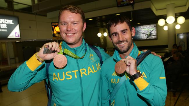 Bronze medallist archery team members Taylor Worth and Ryan Tyack. Olympic athletes arrive back in Brisbane. Pic Peter Wallis