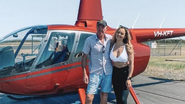 Mr Kraft with his daughter Ashleigh and the Robinson R-66 helicopter. Picture: Instagram