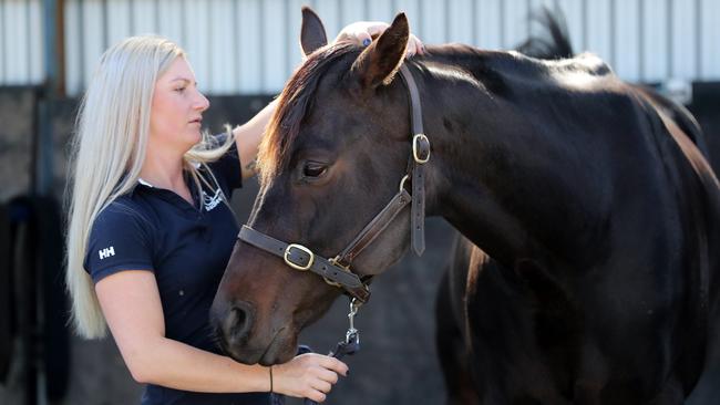 Star jockey Jamie Kah at her Mornington Peninsula with her horse Brax. Picture: Alex Coppel