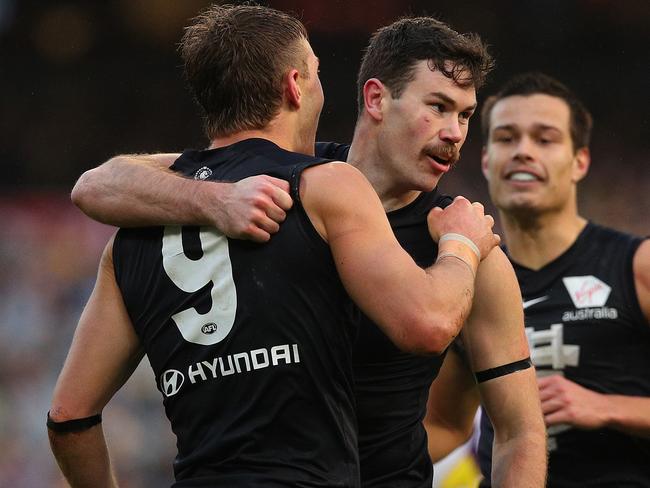 MELBOURNE, AUSTRALIA - AUGUST 11: Mitch McGovern of the Blues (C) celebrates kicking a goal during the round 21 AFL match between the Richmond Tigers and the Carlton Blues at Melbourne Cricket Ground on August 11, 2019 in Melbourne, Australia. (Photo by Graham Denholm/Getty Images)