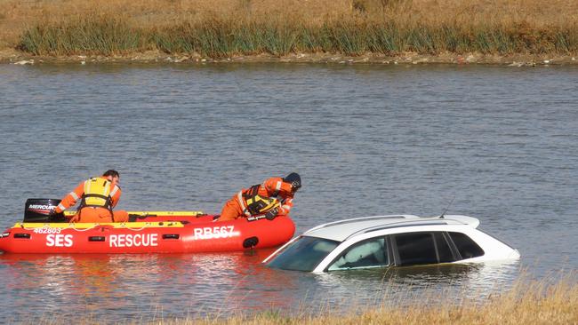 SES volunteers looking inside the vehicle.