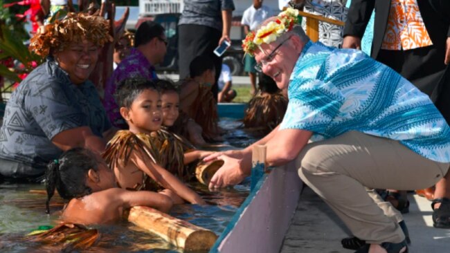 Everyone seems happy enough at the symbolic climate crisis swimming pool