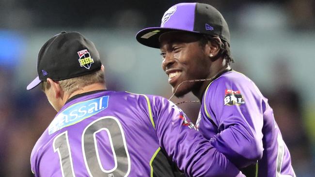 Hurricanes captain George Bailey and Jofra Archer celebrate a Strikers wicket on Thursday night. Photo: Rob Blakers