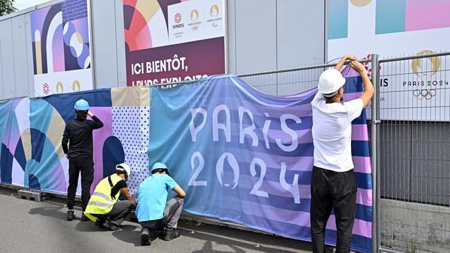 PARIS, FRANCE - JULY 11: Workers are setting up logos during the media visit of Paris 2024 South Arena on July 11, 2024 in Paris, France. (Photo by Aurelien Meunier/Getty Images)