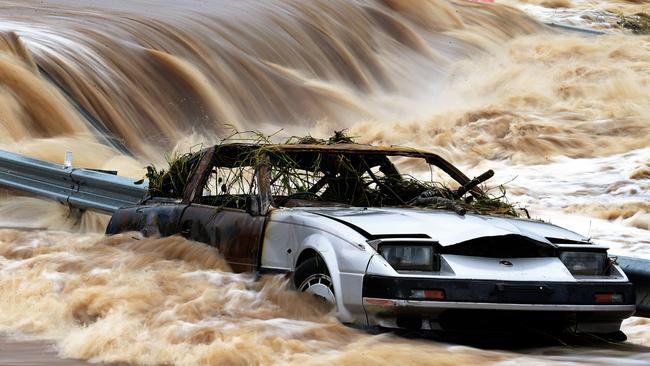 The John Muntz Causeway over the Coomera River is flooded. Picture: Adam Head