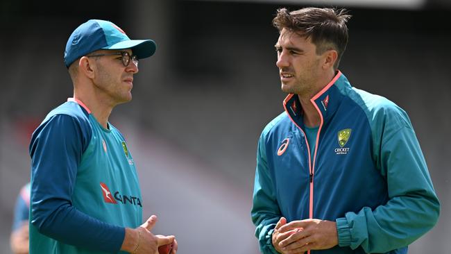 Australian captain Pat Cummins speaks with Todd Murphy during a nets session at Old Trafford. Picture: Gareth Copley/Getty Images