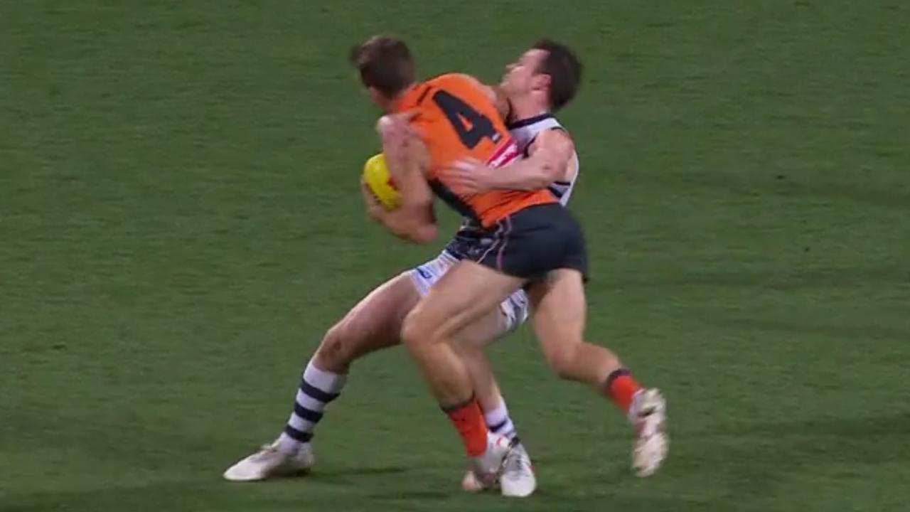 Patrick Dangerfield was subbed out of the game after this high fend off from Toby Greene. Picture: Fox Footy