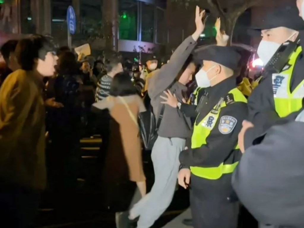 Furious protesters have taken to the streets over a deadly blaze at a tower block under lockdown. Picture: AFP