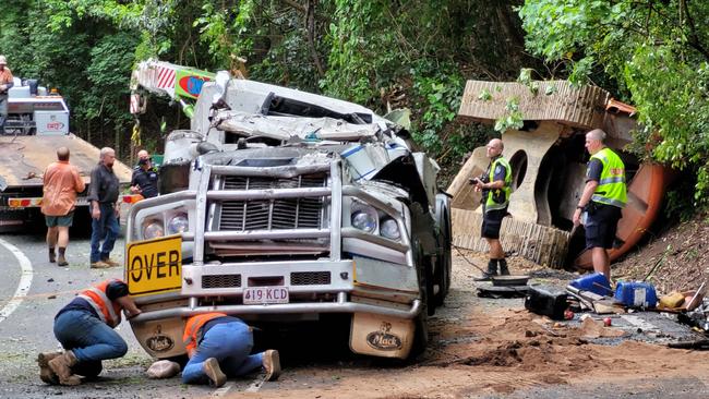 Crews at the scene of a truck rollover on February 1 on the Kuranda Range. The truck rolled over near the "hairpin" of the Kennedy Hwy, at Macalister Range. Picture: Brendan Radke