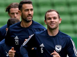 Melbourne Victory players Leigh Broxham (right) and Carl Valeri (second right) and teammates are seen during a training session at AAMI Park in Melbourne, Monday, March 12, 2018. Melbourne Victory will take on Kawasaki Frontale from Japan, in tomorrow's AFC Champions League Group F match. (AAP Image/Joe Castro) NO ARCHIVING