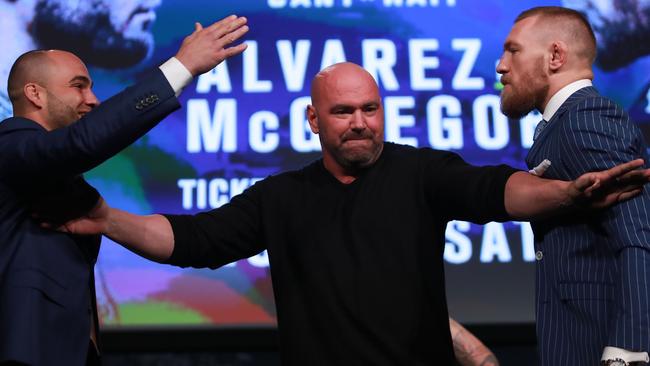 Conor McGregor and Eddie Alvarez face-off as UFC president Dana White breaks them up.
