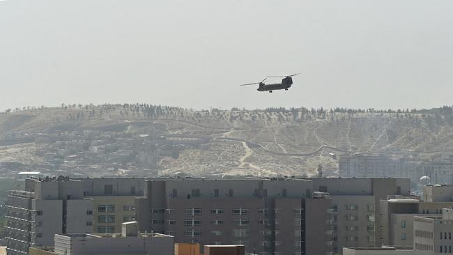 A US military helicopter is pictured flying above of US embassy in Kabul. Picture: AFP