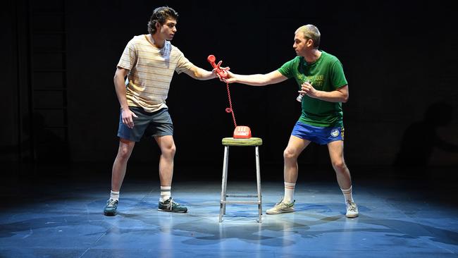 Actors Joe Klocek, who plays Eli Bell, and Tom Yaxley who plays his brother August, in the secret room with the red telephone , on stage at the Playhouse, QPAC in the theatrical adaptation of Trent Dalton's novel Boy Swallows Universe which is sold out. Lyndon Mechielsen/The Australian