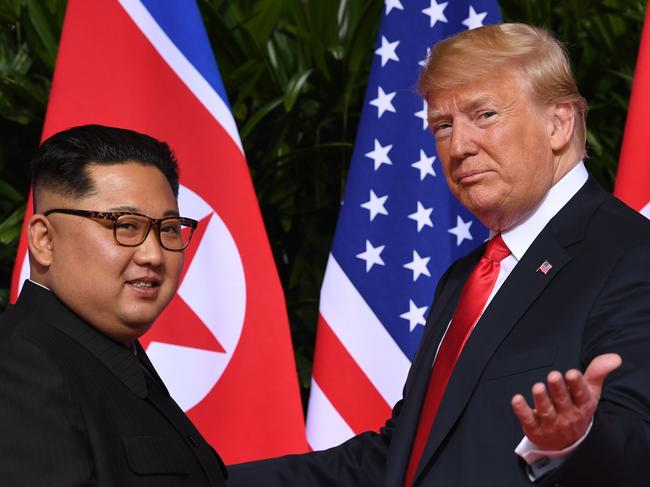 (FILES) In this file photo taken on June 11, 2018 US President Donald Trump (R) gestures as he meets with North Korea's leader Kim Jong Un at the start of their historic US-North Korea summit, at the Capella Hotel on Sentosa island in Singapore. - Two years after a landmark summit between North Korea's Kim Jong Un and US President Donald Trump, any hopes for improved ties have turned to feelings of "despair", Pyongyang's foreign minister said on June 12, 2020. (Photo by SAUL LOEB / AFP)