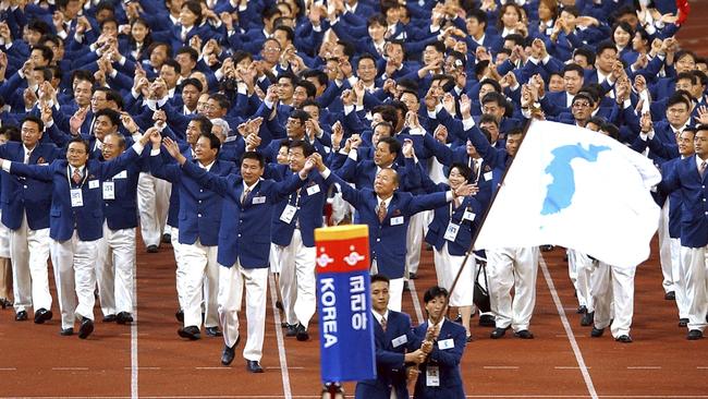 The North and South Korean teams march together at the opening ceremony of the 2002 Asian Games in Busan. Picture: AP