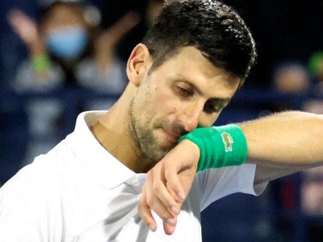 Serbia's Novak Djokovic reacts to his defeat by Czech Republic's Jiri Vesely during their quarter-final match at the ATP Dubai Duty Free Tennis Championship, in the Gulf emirate on February 24, 2022. (Photo by Karim SAHIB / AFP)