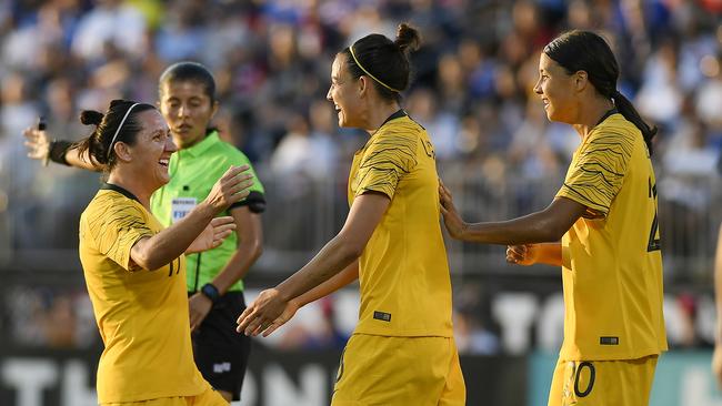 Australia's Chloe Logarzo, center, celebrates her goal with teammates Lisa De Vanna, left, and Sam Kerr, right, during the Matildas women's international soccer match against the United States today. Picture: AP