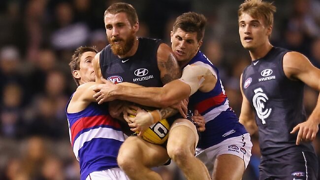 Carlton defender Zach Tuohy and Ciaran Byrne in action against ...