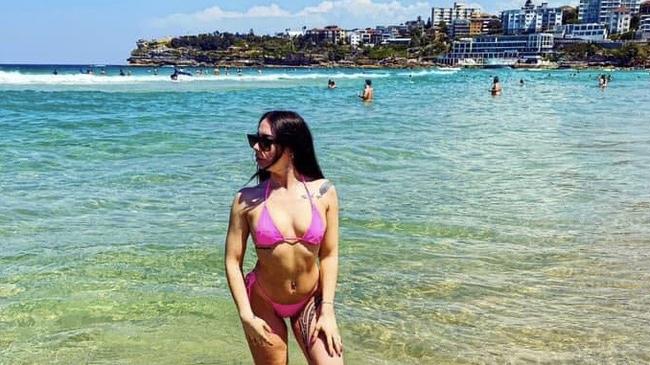 Maellis Jabinet, from Marrickville, enjoying Bondi Beach. She has been charged after allegedly flashing a gun in videos.