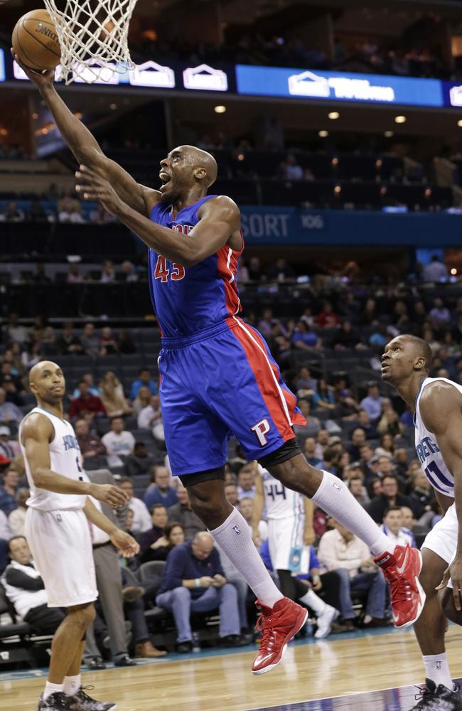 Detroit Pistons' Anthony Tolliver (43) drives past Charlotte Hornets' Noah Vonleh (11) and Gerald Henderson (9) during the second half of an NBA basketball game in Charlotte.