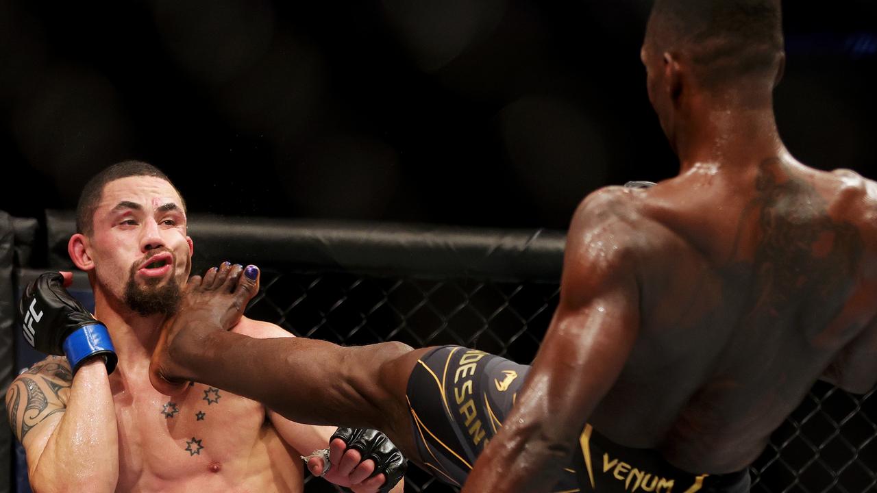 Nigeria-born Israel Adesanya kicks Robert Whittaker. Photo by Carmen Mandato/Getty Images
