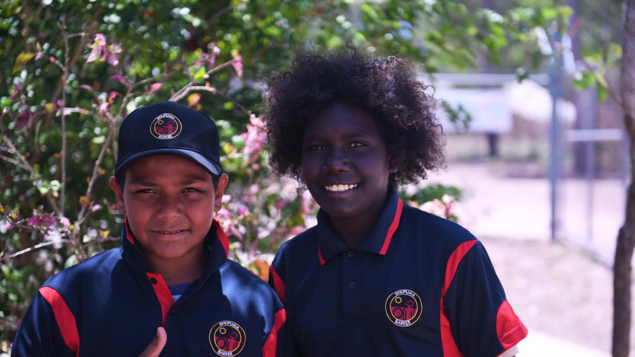 Dhupuma Barker students on their way to washing the new school bus. Picture: Amanda Parkinson