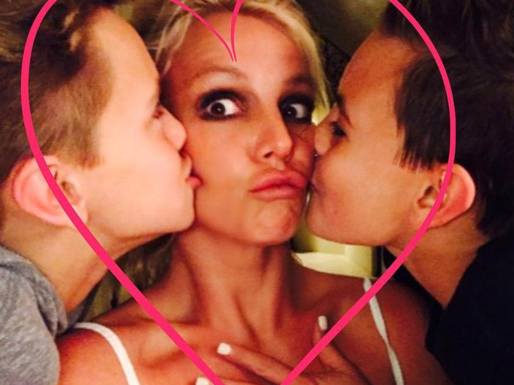 Britney Spears pouts her duck lips while getting love from her boys. "My lovies." Picture: Britney Spears / Instagram