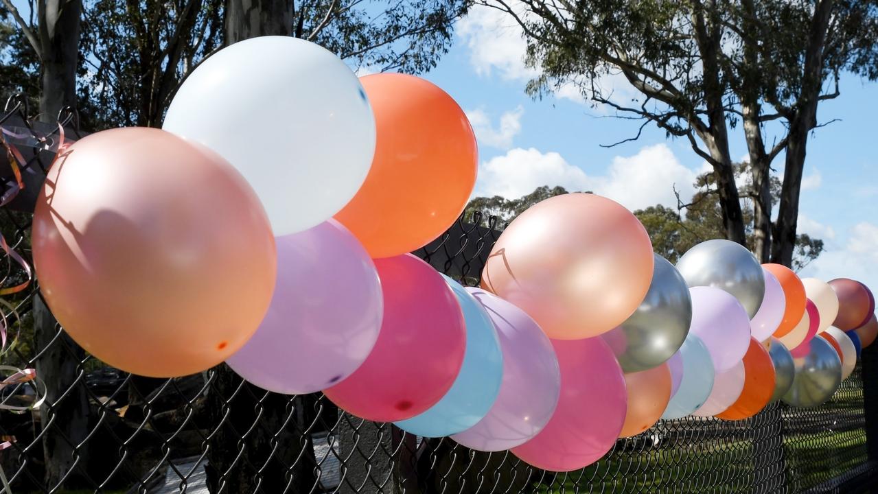 Balloons line the streets of Tahmoor as a tribute to five crash victims. Picture: Backgrid via NCA NewsWire