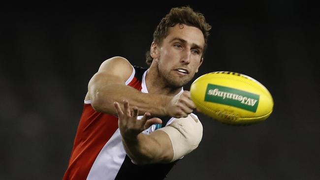 MELBOURNE, AUSTRALIA - JULY 30: Luke Dunstan of the Saints handballs during the round 20 AFL match between St Kilda Saints and Carlton Blues at Marvel Stadium on July 30, 2021 in Melbourne, Australia. (Photo by Darrian Traynor/Getty Images)