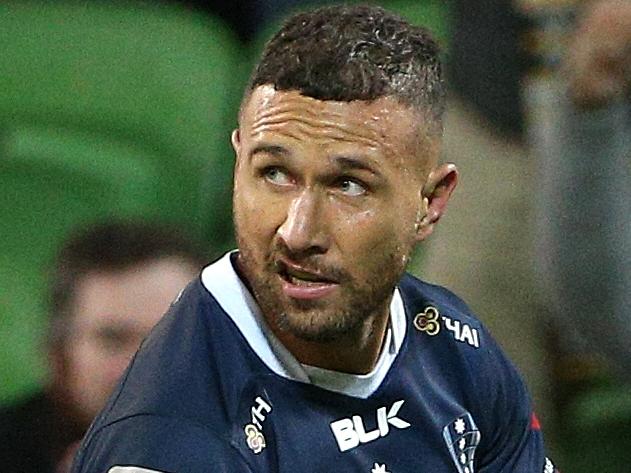 Quade Cooper of the Rebels scores a try during the Round 16 Super Rugby match between the Melbourne Rebels and the NSW Waratahs at AAMI Park in Melbourne, Friday, May 31, 2019. (AAP Image/Hamish Blair) NO ARCHIVING, EDITORIAL USE ONLY