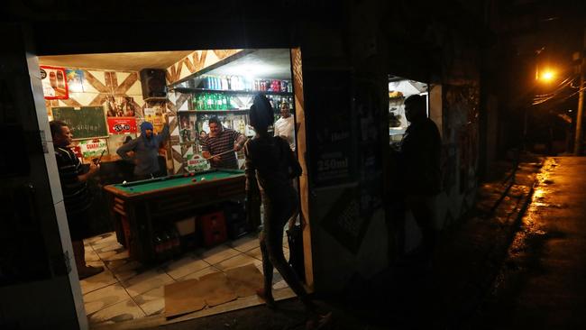 People gather in a bar in the Vidigal favela community in Rio de Janeiro. The Lava Jato (Car Wash) corruption scandal is the biggest in the country’s history. Picture: Mario Tama/Getty Images