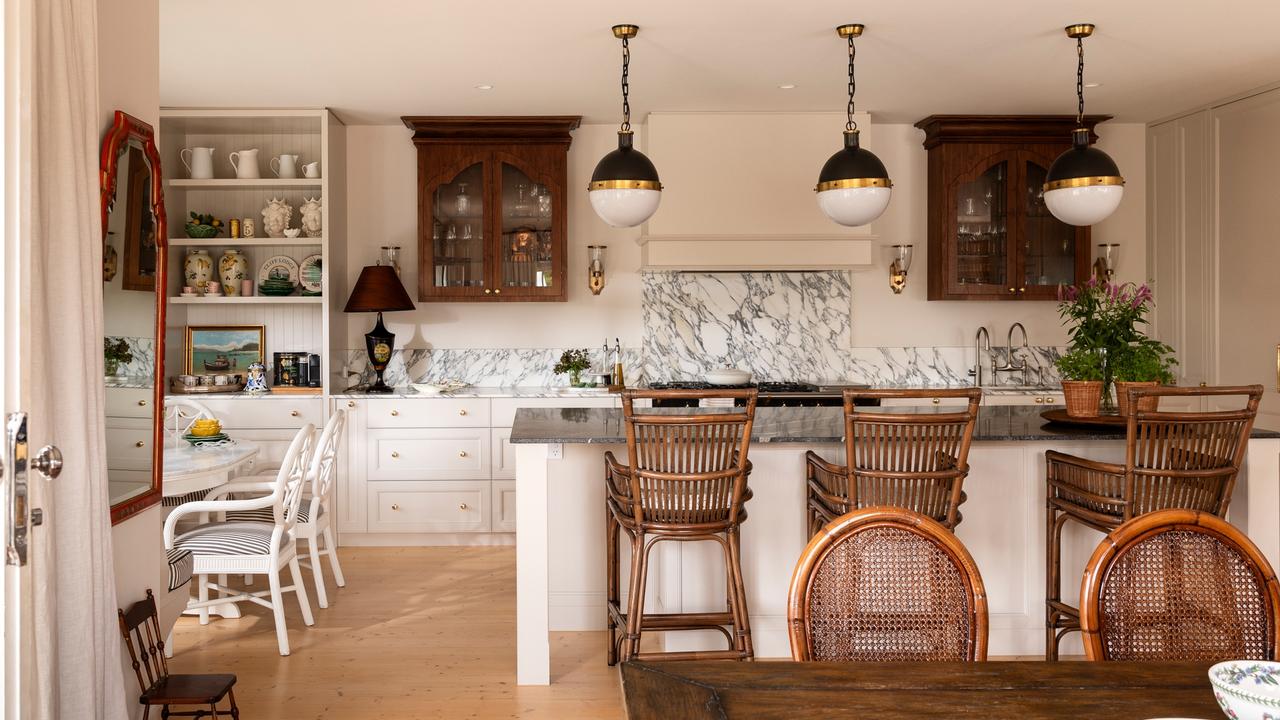 Marble counters and splashbacks, English tapware, a Zip tap and an integrated fridge and freezer feature in the kitchen.