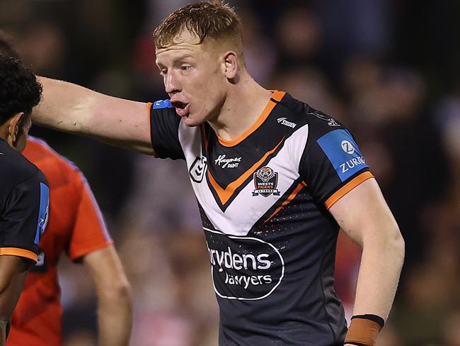 WOLLONGONG, AUSTRALIA - JUNE 07: Alex Seyfarth of the Wests Tigers talks to team mate Jahream Bula during the round 14 NRL match between St George Illawarra Dragons and Wests Tigers at WIN Stadium on June 07, 2024, in Wollongong, Australia. (Photo by Jason McCawley/Getty Images)