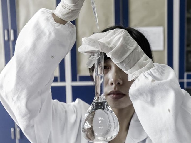 A technician holds a beaker in a quality control laboratory at a China Grand Pharmaceutical and Healthcare Holdings Ltd. facility in Wuhan, China, on Tuesday, June 13, 2017. China Grand Pharma mainly aims to export finished drugs to developing markets and hasn’t faced regulatory actions from the U.S. or European drug quality watchdogs, according to the company. Photographer: Qilai Shen/Bloomberg