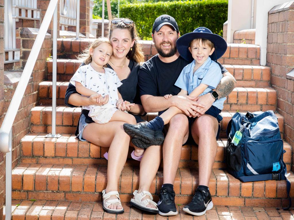 Parents Lucy and Bayden Tierney with Peggy and Rupert outside St Agatha's Primary School at Clayfield where little Rupert is “loving life”. Picture: Richard Walker