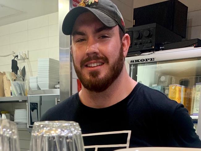 Marcus Cutler back working in his parents cafe at Manly after his big day out at Randwick rugby. Pic: Supplied