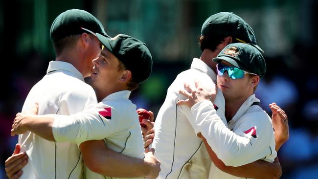 Australian captain Steve Smith, far right, leads Australia to victory at the SCG.