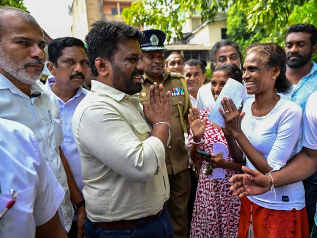 Sri Lankan President Anura Kumara Dissanayake is greeted by locals after after casting his ballot in Sri Lanka's parliamentary election in Colombo on November 14. Picture: Ishara S. KODIKARA / AFP